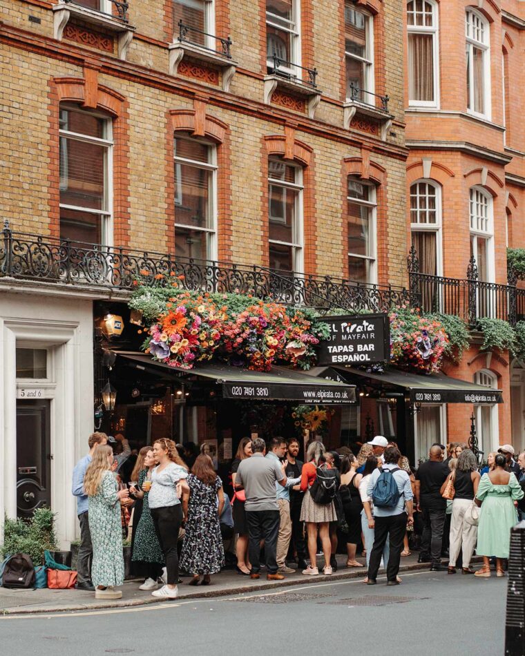 Group party standing reception wine tapas bar Mayfair London at Hyde Park Corner
