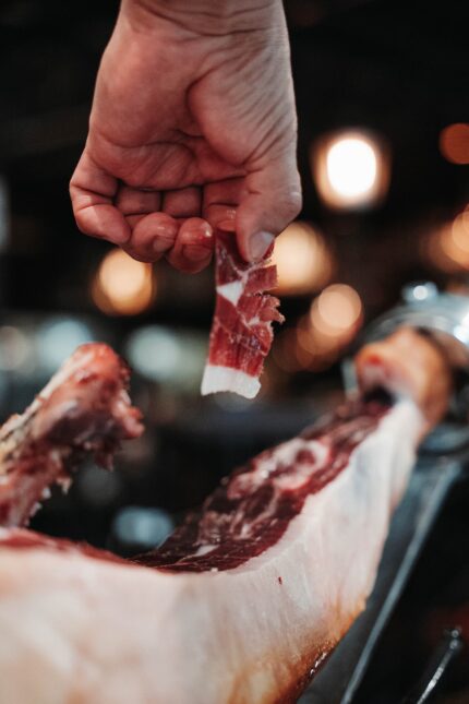 A premium leg of Jamón Ibérico on a carving stand at El Pirata London