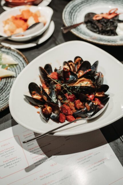 Mussels chorizo tomato sauce tapas dish served in our restaurant