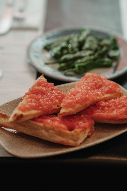 Pan bread tomato padron peppers at Mayfair restaurant