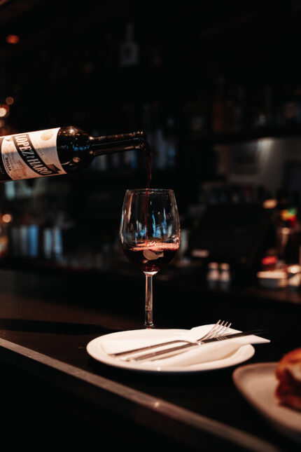 Pouring red Spanish Rioja wine at our tapas bar